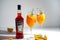 Italian tincture Aperol for making cocktail Aperol Spitz. Red-orange wine in a bottle. Alcoholic drink. Aperitif with