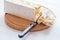 Italian torrone or nougat with almonds on a white wooden table, close up with selected focus