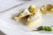 Italian tortellini covered with parmesan cream