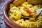 Italian traditional food called tortellini in brodo with bread