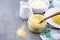 Italian traditional Polenta, porridge made from cornmeal. Mamaliga With Cottage Cheese and sour cream on rustic background.