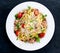 Italian Tuna Pasta spaghetti with tomato, chili, Parmesan cheese and wild rocket lives. on old blue stone background