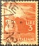 Italian used postage stamp depicting a hand with a torch