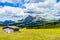 Italy, Alpe di Siusi, Seiser Alm with Sassolungo Langkofel Dolomite, an old barn in a field