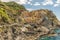 Italy, Cinque Terre, Manarola, Manarola, PANORAMIC VIEW OF BEACH AND BUILDINGS AGAINST SKY