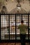 Italy. Faith and Religion. Bari. Basilica of San Nicola. A man prays in front of the chapel with the relics of the saint in cripta