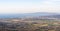 Italy Grosseto Maremma, route in MTB and EMTB in the woods of Gavorrano up to Mount Calvo, panoramic view of the village and the