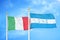 Italy and Honduras two flags on flagpoles and blue cloudy sky