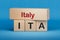 Italy and ITA symbol. Concept words Italy and ITA on wooden blocks.