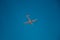 Italy, Lombardy, Milan 1.12.2023. Airplane against blue sky. The plane lands at the Italian airport Linate