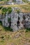 Italy. Matera. Gravina canyon. Natural grotto in the limestone cliff. In Middle Ages became rupestrian hermitages and monasteries