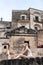 Italy. Matera. The lovely ceramic girls by Margherita Grasselli, look out over the old town from a terrace in Sasso Barisano