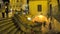 Italy. Matera. People climb a covered staircase between the Sasso Barisano and the Civita district above.