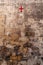 Italy. Matera. A red cross on the wall of an ancient defense tower marks the place where the Porta di Iuso, the door at the bottom