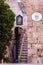 Italy. Matera. The Sassi. Tipical old house with external staircase and niche with sacred image