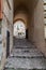 Italy. Matera. Sasso Barisano. Covered public paved stairway between the ancient houses