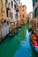 Italy - May 20, 2019: View on canal with gondola boat and motorboat water / river