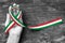 Italy national flag color ribbon pattern on people`s hand isolated  with clipping path for Italian or nation support and holiday
