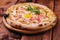 Italy pizza with egg yolk, ham and onion