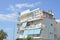 Italy, Rome, Ostia, Tyrrhenian Sea. Typical residential apartments. Blue house with balconies, windows covered