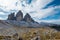 Italy`s Tre Cime rock formations... tall against partly sunny skies