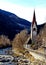 Italy, Trentino Alto Adige, Bolzano, San Candido, view of the Aurino River with the small church dedicated to the Holy Spirit