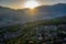 Italy, Trento, 01 May 2019: Panorama of the city at sunset, facade of buildings, Picturesque view of mountains through