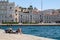 Italy, Trieste, a tourist lying in the sun on the daring pier