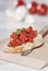 Italy, Tuscany, Magliano, Close up of bruschetta with knife on chopping board