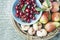 Italy, Tuscany, Magliano, Close up of peach pears and cherries in basket, elevated view