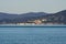 Italy Tuscany Maremma, on the beach towards Bocca di Ombrone, view of the coast line, in the background Marina di Grosseto and