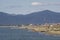 Italy Tuscany Maremma, on the beach towards Bocca di Ombrone, view of the coast line, in the background Marina di Grosseto and