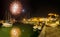 Italy, Tuscany Maremma Castiglione della Pescaia, fireworks over the sea, panoramic night view of the port and the castle