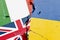 Italy, UK (Great Britain), Ukraine national flag isolated on broken wall