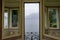 Italy, Varenna, Lake Como viewed through a door window