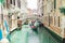 Italy, Venice - May 25, 2019: people at gondola taking tour by canal