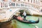 Italy, Venice - May 25, 2019: people at gondola taking tour by canal