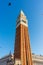 Italy, Venice, St Mark\\\'s Campanile, a large tall tower with a clock on the side of St Mark\\\'s Campanile