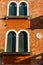 Italy, Venice, window arch on a red building
