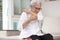 Itchy senior woman is scratching her arm causes of itching from mosquitoes,insect bites or dry itchy skin,old elderly with an