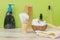 Items for shaving, washing and combing on a wooden table on a green background