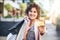 Itll save you time and trouble. Shot of a woman holding up her credit card while out shopping.