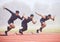 Its all about the start. Full length shot of three handsome young male athletes starting their race on a track.