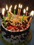 Its Beautifully designed birthday cake having lighting candles on it looks gorgeous