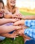 Its cool to be kind. Cropped shot of a group of kids stacking their hands on top of each other.