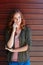 Its a good day to have a good day. Portrait of an attractive young woman posing against a wooden wall.