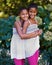 Its great having a twin. Portrait of two twin sisters standing together outside.