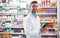 Its a handy tool to have around the pharmacy. Portrait of a handsome mature pharmacist using a digital tablet in a