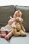 Its her favourite teddy. Portrait of an adorable baby girl playing with a teddybear at home.