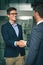 Its important to continually make new business contacts. two businessmen shaking hands in an office.